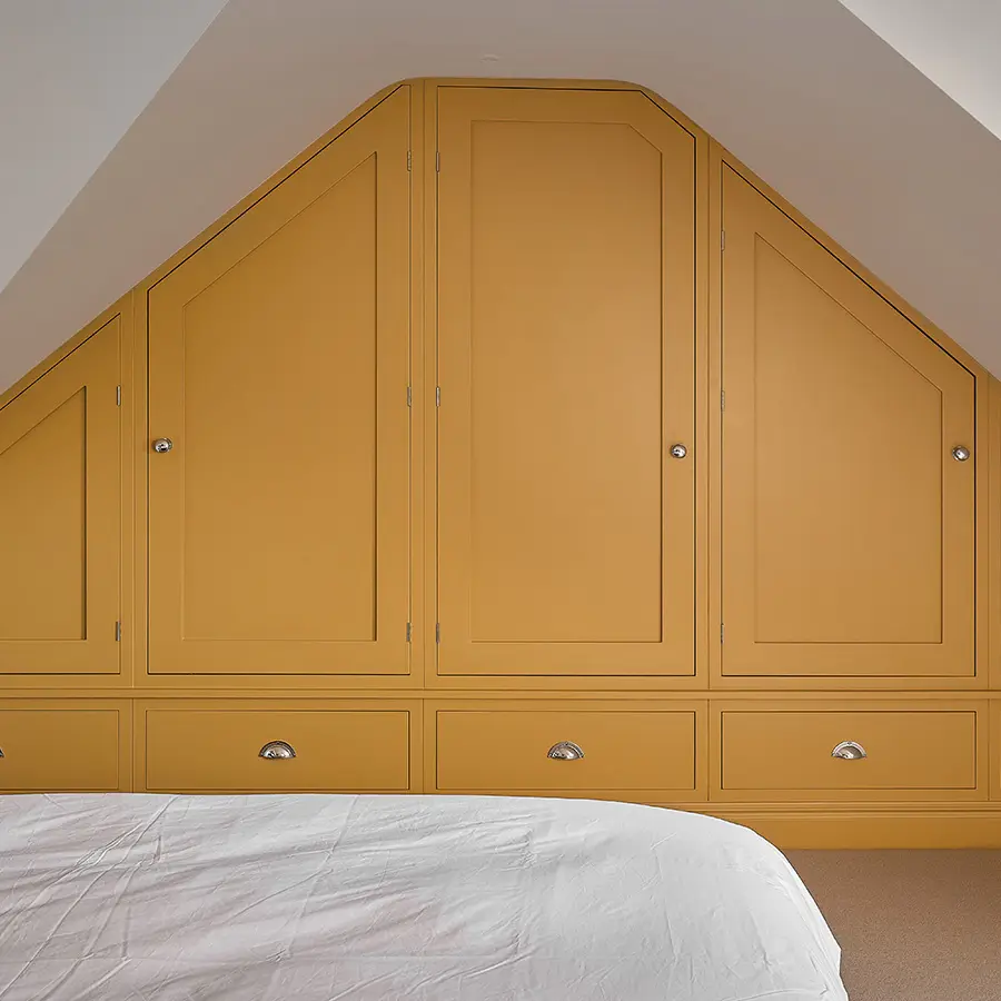 Handcrafted slopped ceiling fitted wardrobe